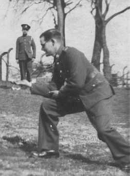 Trooper Wilson standing on Ernest's hand